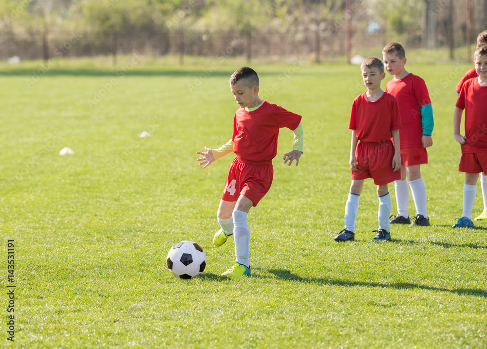 Kids soccer football - children players match on soccer field