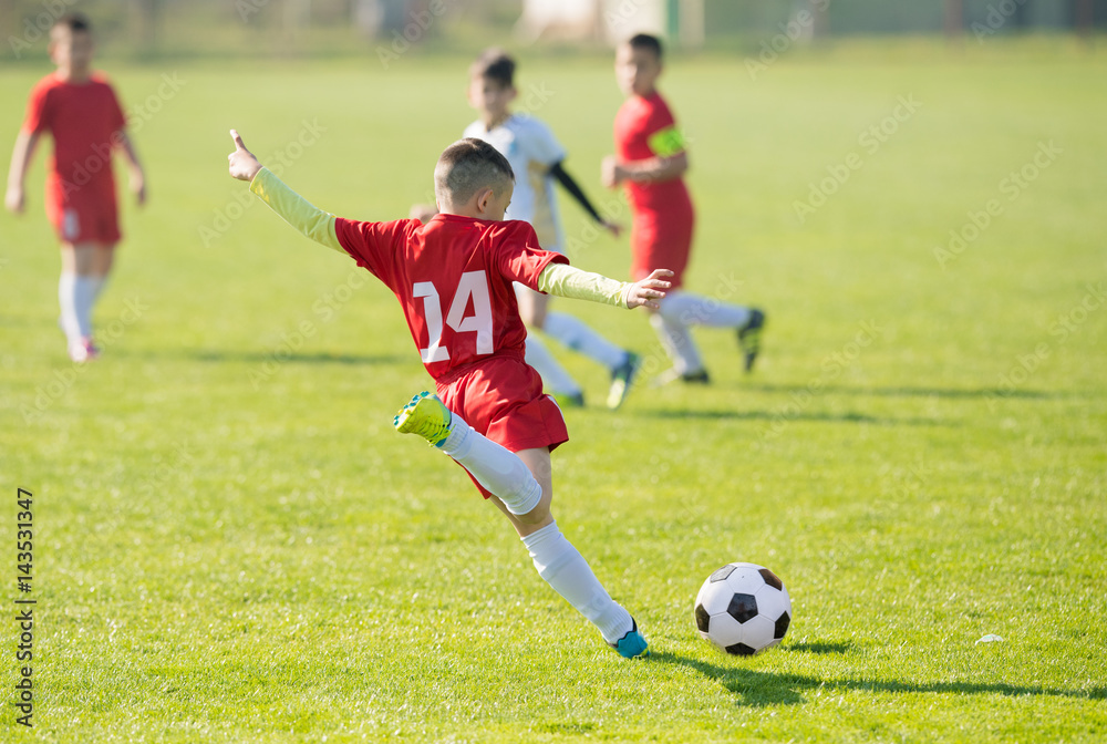 Kids soccer football - children players match on soccer field Kids soccer football - children players match on soccer field