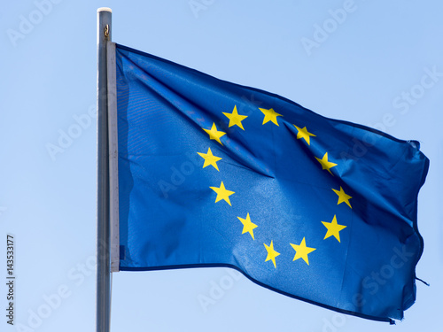 EU Flag or European Union flag on blue sky 