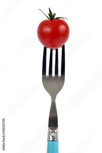 Tomate cerise piquée sur une fourchette