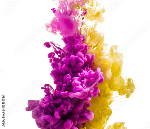 colorful ink isolated on white background. pink yellow drop swirling under water. Cloud of ink in water. 