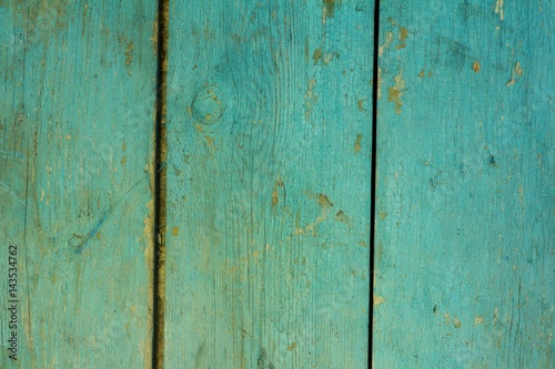 The texture of old painted wooden boards on which over time a lot of cracks and defects appeared © bocha19871208