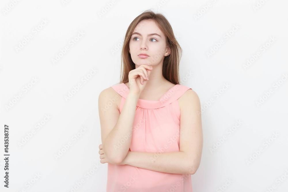 Young casual woman In pink blouse isolated over white background studio portrait Young casual woman In pink blouse isolated over white background studio portrait