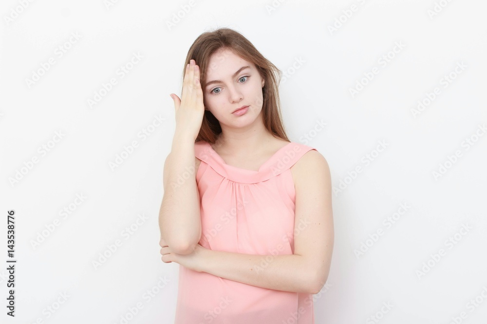Young casual woman In pink blouse isolated over white background studio portrait Young casual woman In pink blouse isolated over white background studio portrait