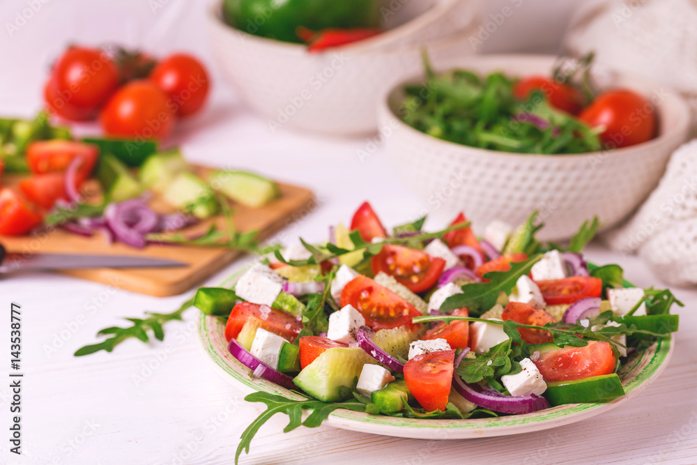 Traditional Bulgarian salad Shopski with fresh vegetables and feta