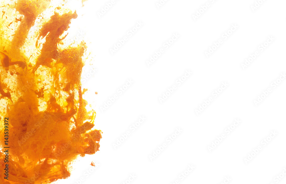 White background with yellow paint in water White background with yellow paint in water