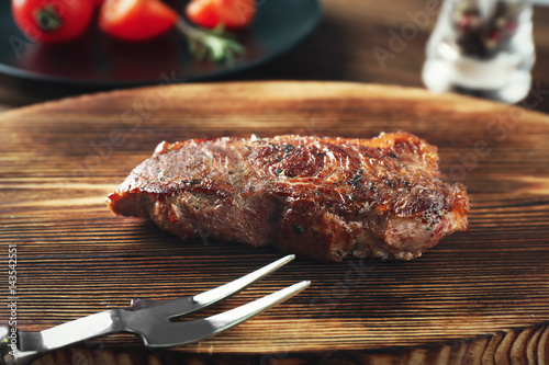 Delicious grilled steak on wooden board