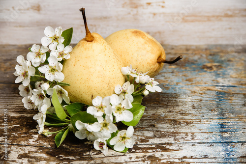 yellow pears on wood background 