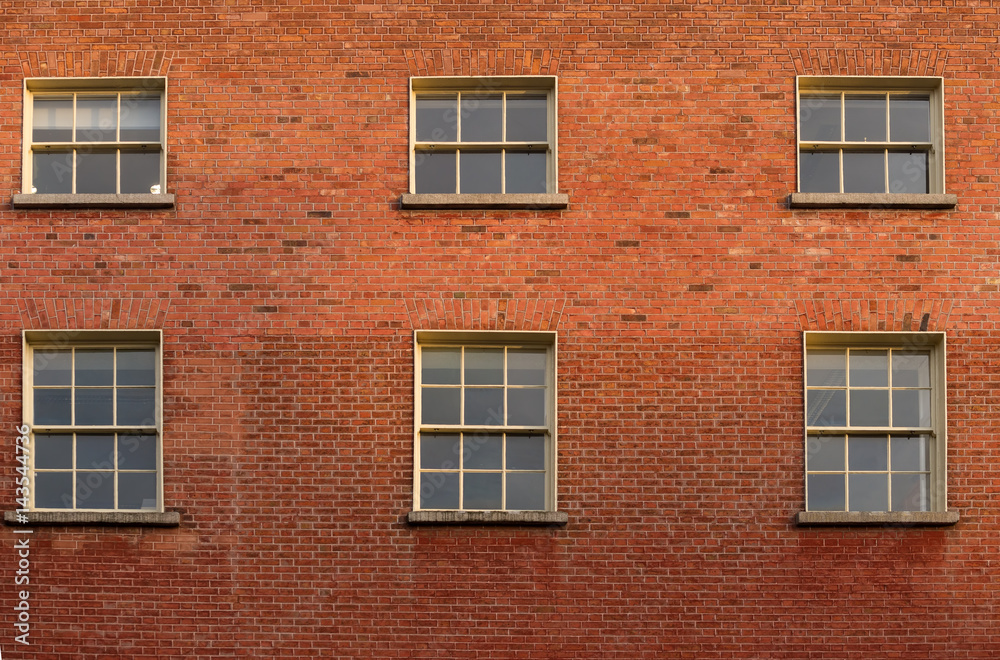 Six windows on a brick building