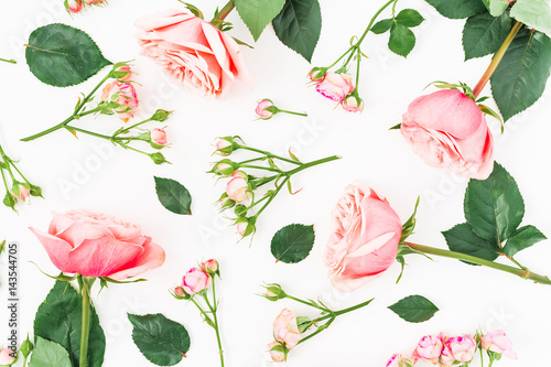 Pattern with pink roses  leaves and buds on white background. Flat lay  top view.