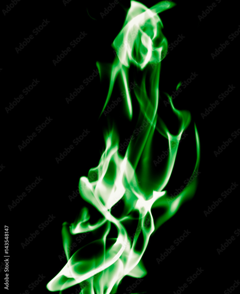 Green flame of fire on a black background