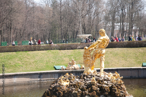 Gold plated sculptures by fountains Grand cascade in Pertergof, Saint-Petersburg, Russia photo