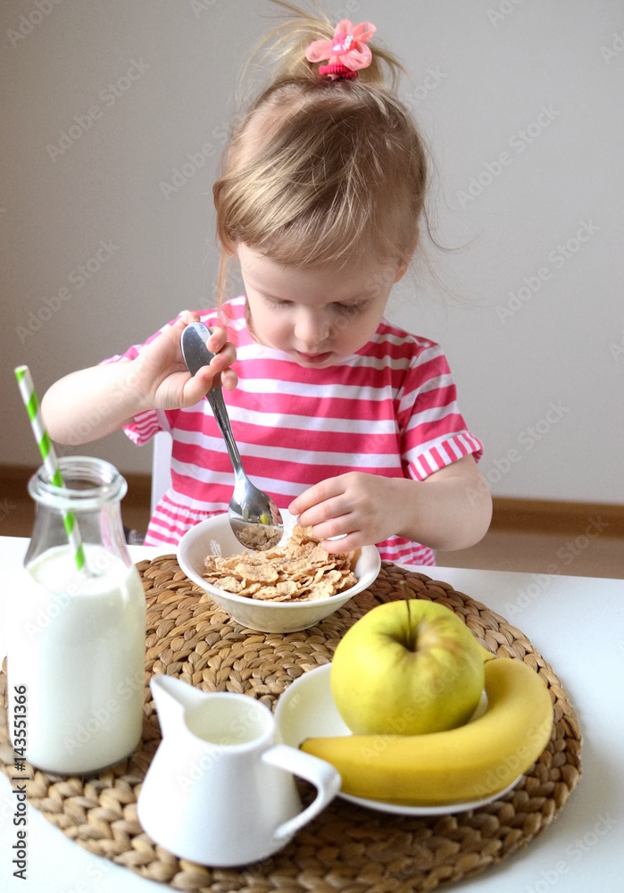 Little baby girl eating healthy breakfast Little baby girl eating healthy breakfast