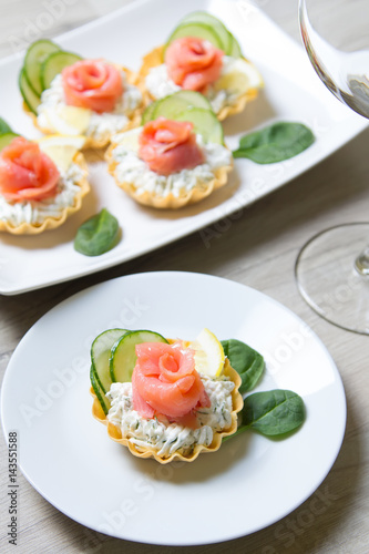 Tartlet with cream cheese, cucumber and slightly salted trout