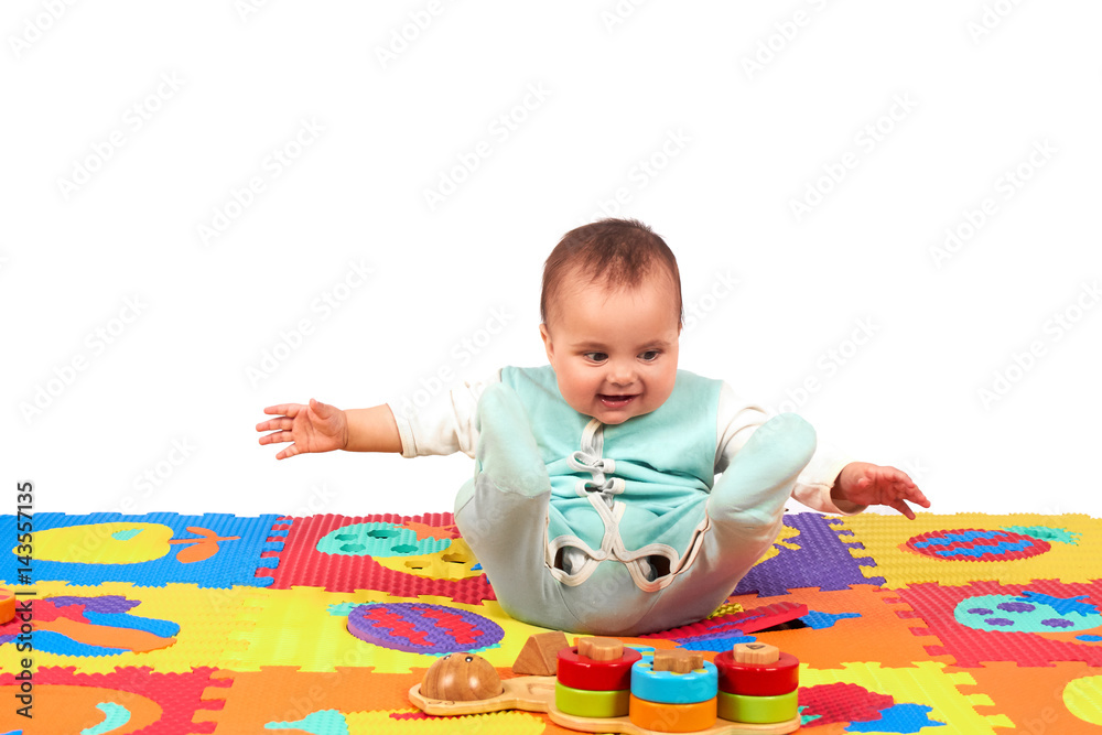 baby girl playing wooden toy blocks isolated on Soft mat baby girl playing wooden toy blocks isolated on Soft mat