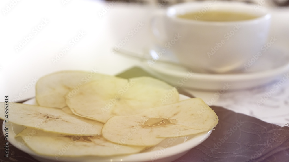 Cup of tea with Baked Dehydrated Apples Chips