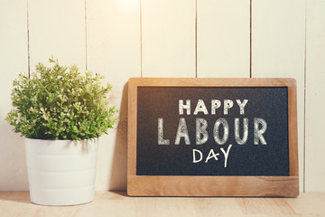 May Day, May 1. Small chalk board with text Labor Day. International Workers' Day