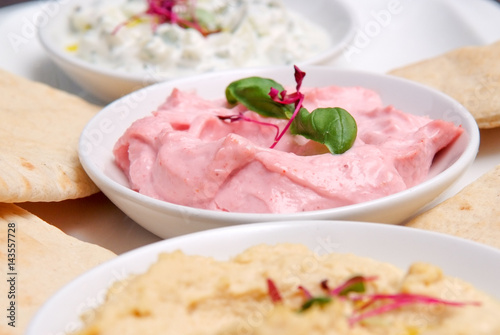 restaurant starter meal of a sharing platter of dips with bread