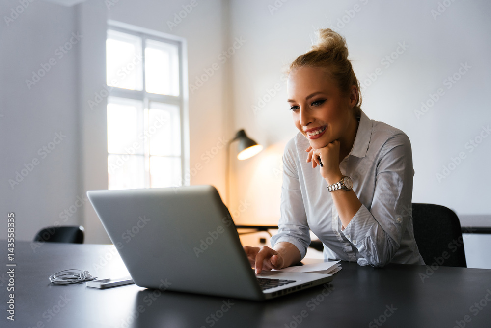 Beautiful blonde girl using her lap top for web surfing Beautiful blonde girl using her lap top for web surfing