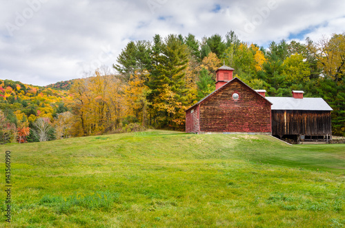 Wooden Barn in a Rural Landscape in Autumn. The Berkshires, Massachusetts, USA photo