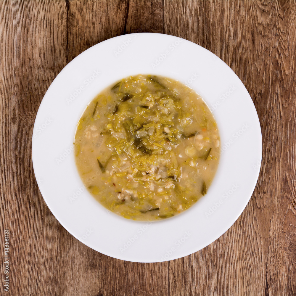 Vegetable soup on a wooden table Vegetable soup on a wooden table