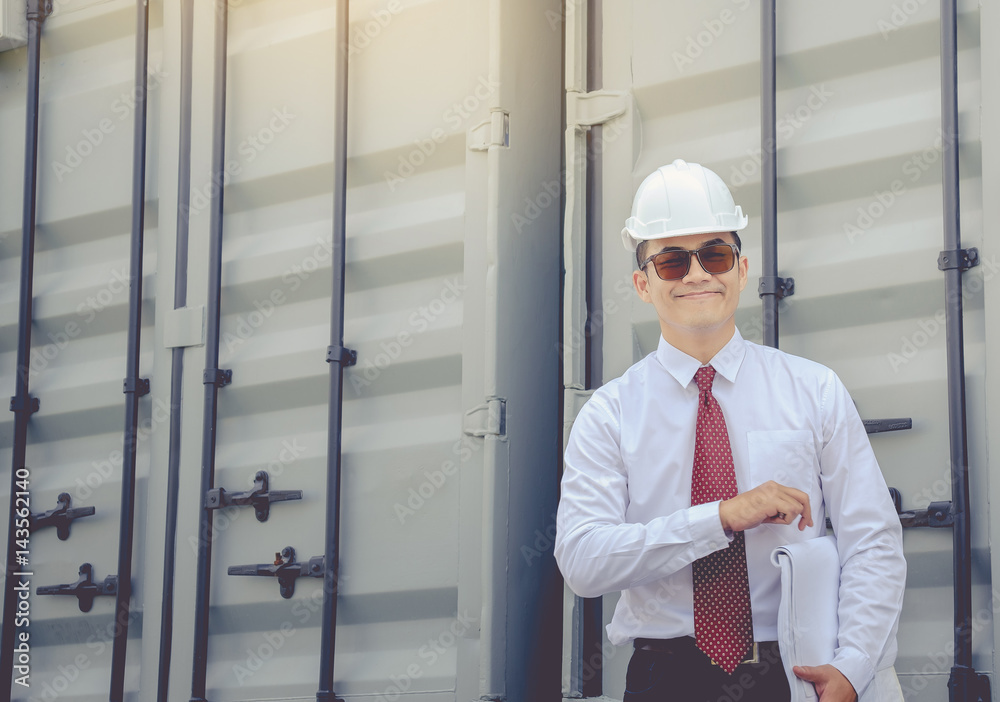 Young architect wearing a white hat, red tie inspector holds thumb is happy with the work. Young architect wearing a white hat, red tie inspector holds thumb is happy with the work.