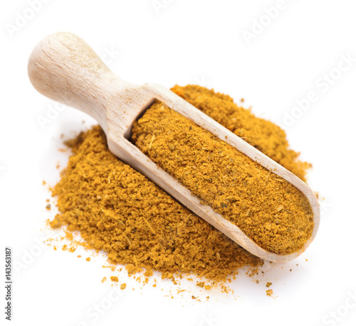 Curry spice in a scoop for spices