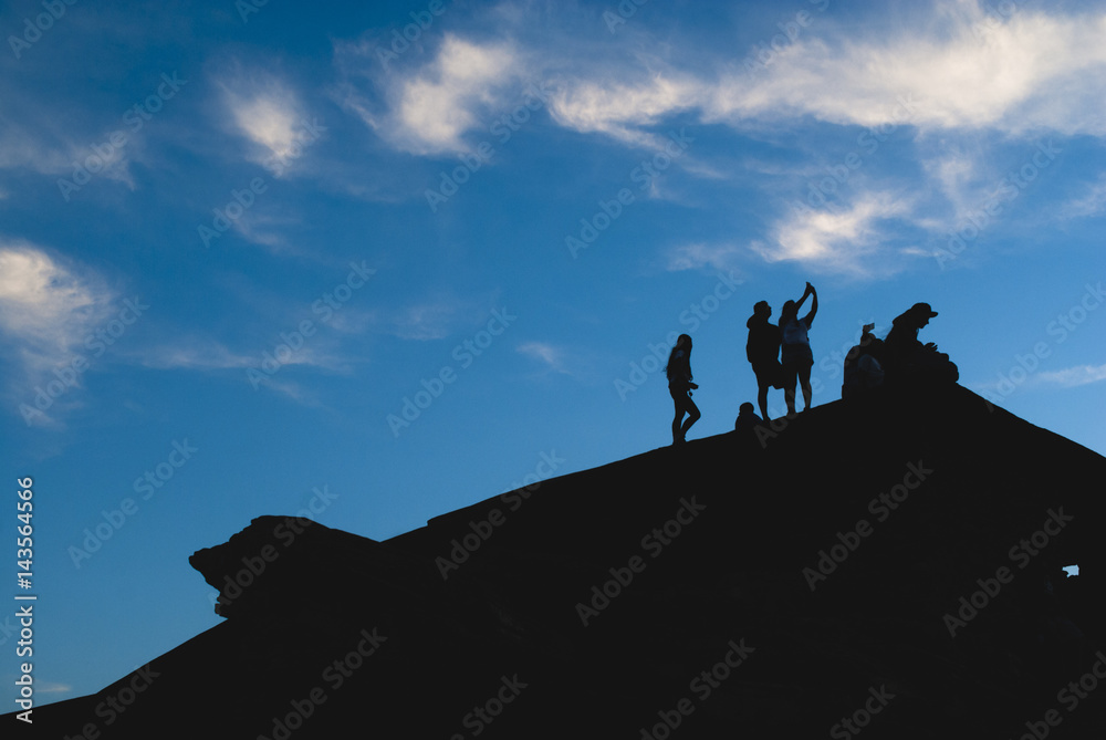 People silhouette at sunset in Brazil