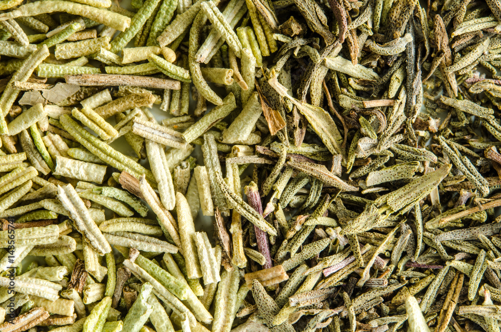 Dry thyme and rosemary leaves. Food background. Closeup macro shot. Top view.