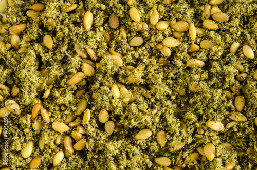 Dry hyssop leaves and seeds. Food background. Closeup macro shot. Top view. photo