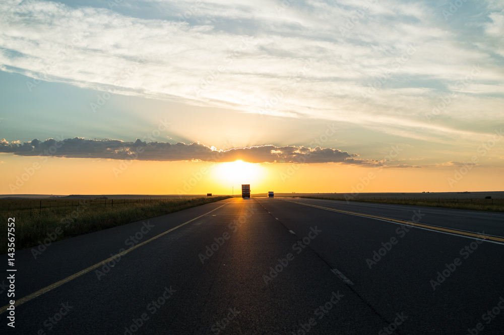 Driving into the Sunset on a Highway, Free State, South Africa