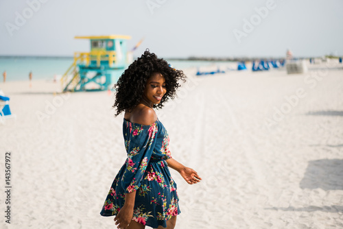 Fashion woman walking on beach with a summer dress © pohlkampkai