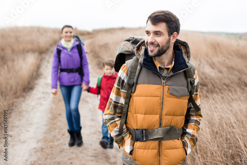 Man with wife and son backpacking