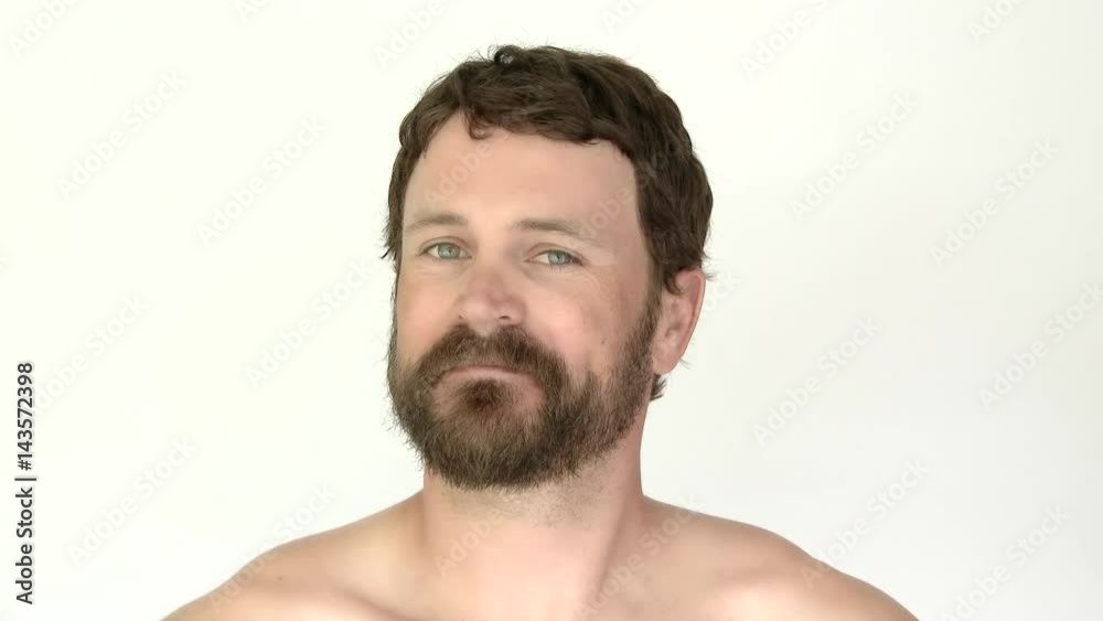 Model released man in studio looking surprised he has facial hair. Model released man in studio looking surprised he has facial hair.