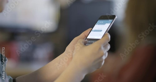 Person holding cell phone and texting, slow motion