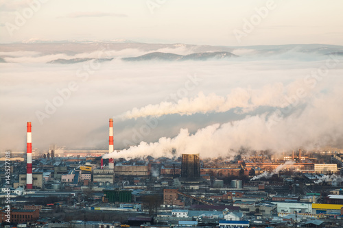 Industrial landscape with factory chimneys.