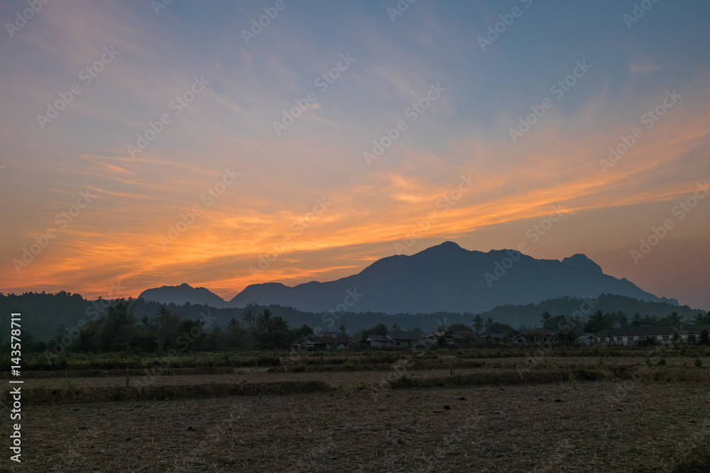 Sunset with mountain and rice field at Vang Vieng Laos, Vang Vieng Laos.