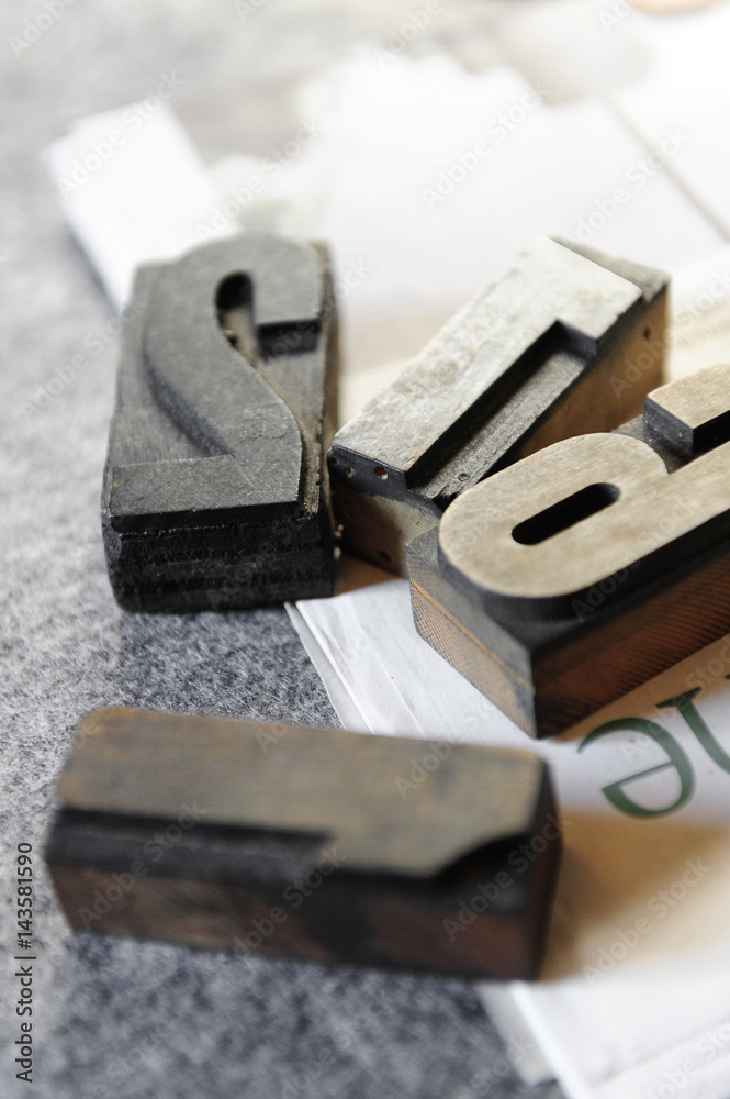 Old printing characters in wood and lead used as decorative object Old printing characters in wood and lead used as decorative object