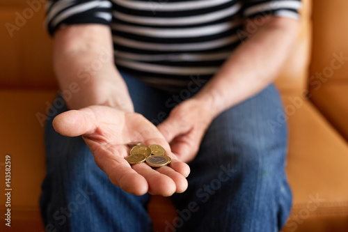 Close up hands of senior woman showing money