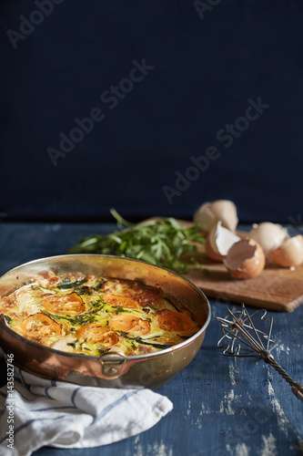 omelette with roasted summer vegetables in a cake tin