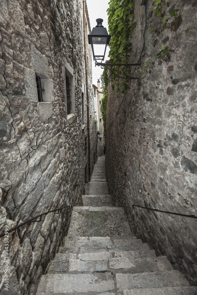 Narrow street in Jewish quarter of Girona, Catalonia, Spain.
