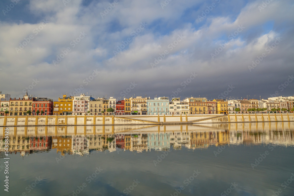 Panoramic view of river and colored houses of Barrio de Triana, quarter. Sevilla, Andalucia, Spain.
