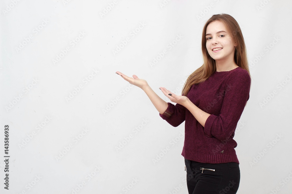 Smiling woman showing open hand palm with copy space for product or text Smiling woman showing open hand palm with copy space for product or text