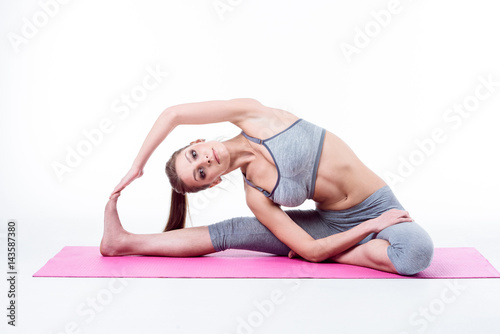 young woman does yoga