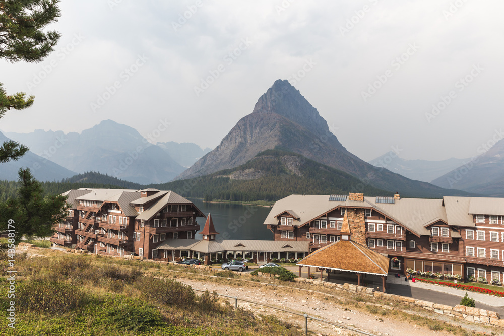 View of Buildings and Mountains at Many Glacier Hotel