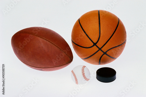 Sports equipmet: football, baseball, basketball,hockey puck, photo