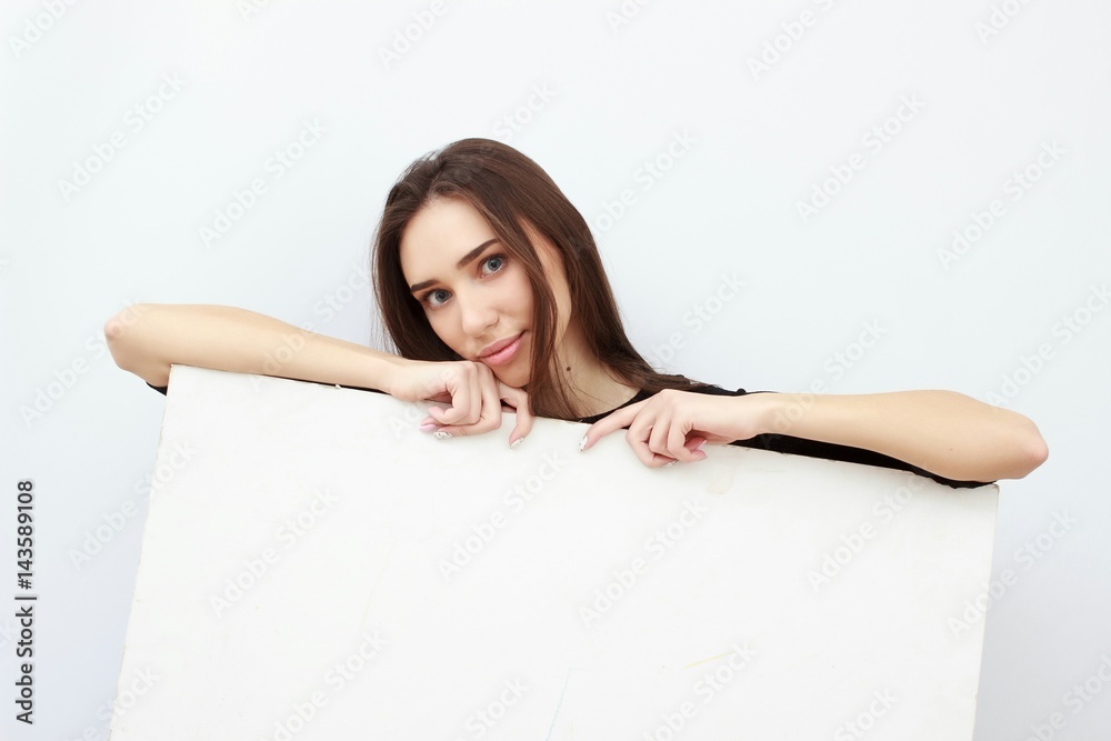 Woman student hold white blank card isolated on white background. Girl model poses. Woman student hold white blank card isolated on white background. Girl model poses.