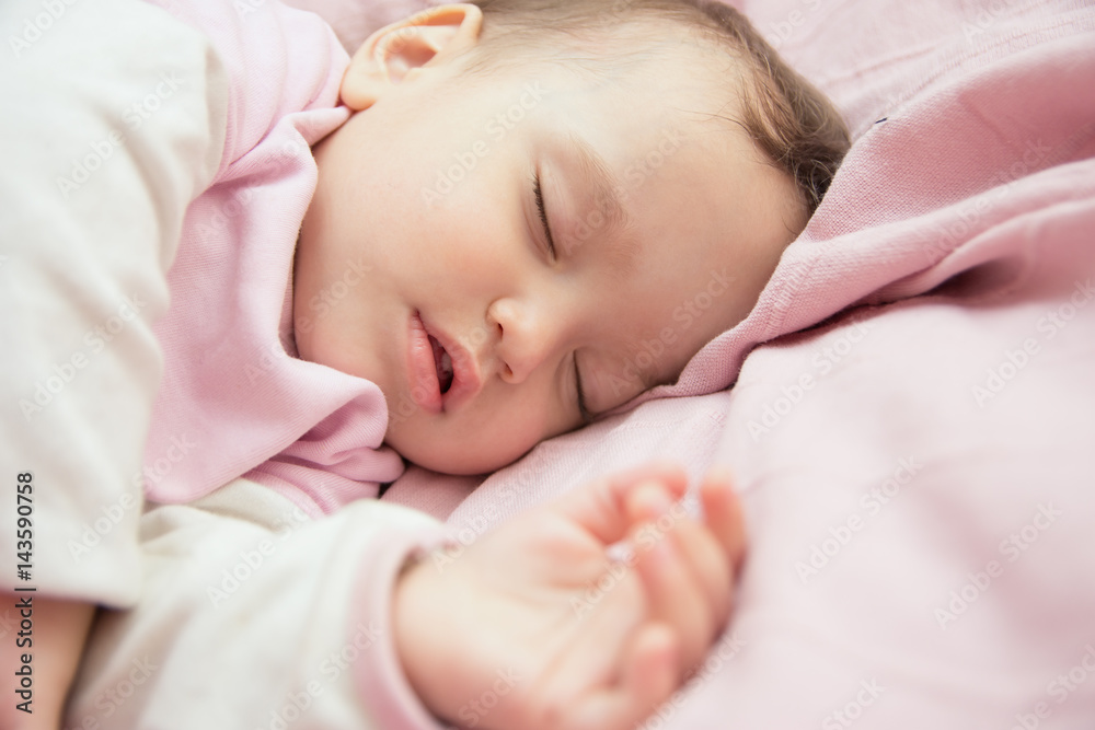 Little girl is sleeping on the bed Little girl is sleeping on the bed