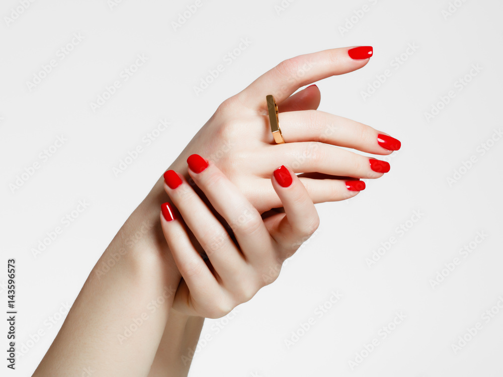 Beauty delicate hands with manicure close up. Beautiful female fingers with manicure and fashionable gold ring. Beautiful nails close-up, great idea for the advertising of cosmetics Beauty delicate hands with manicure close up. Beautiful female fingers with manicure and fashionable gold ring. Beautiful nails close-up, great idea for the advertising of cosmetics