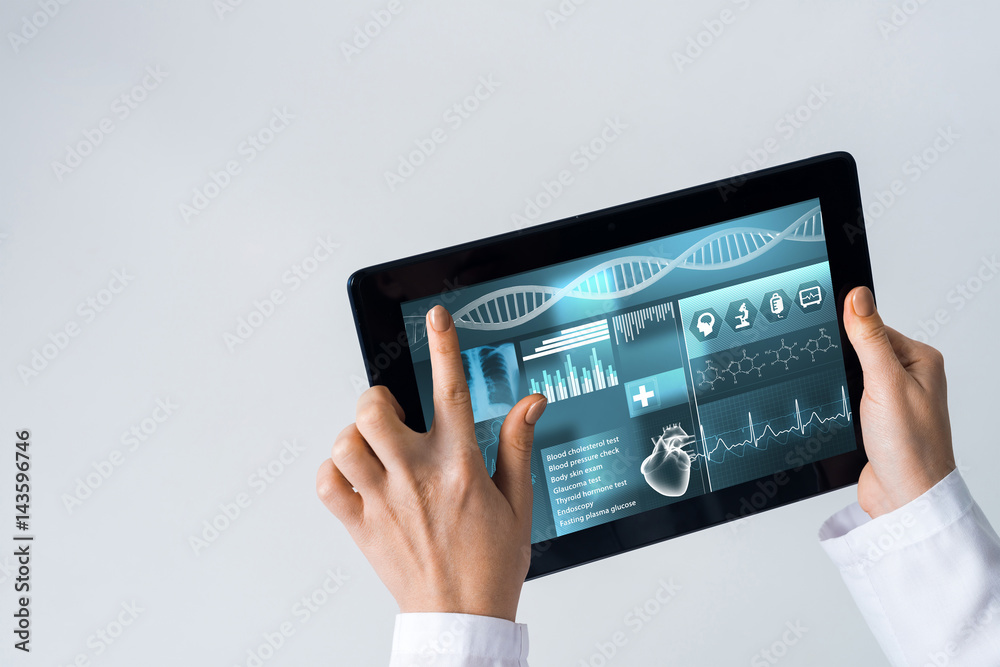 Close of female doctor hands working with tablet pc computer Close of female doctor hands working with tablet pc computer